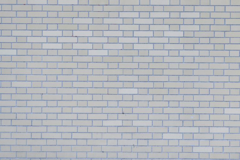 Gray wall with rows of bricks